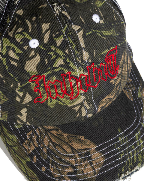 INHIBIT TRUCKER CAP