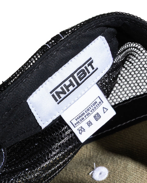 INHIBIT TRUCKER CAP